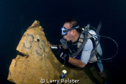 Tail section of Japanese Zero in the hold of sunken freig... by Larry Polster 